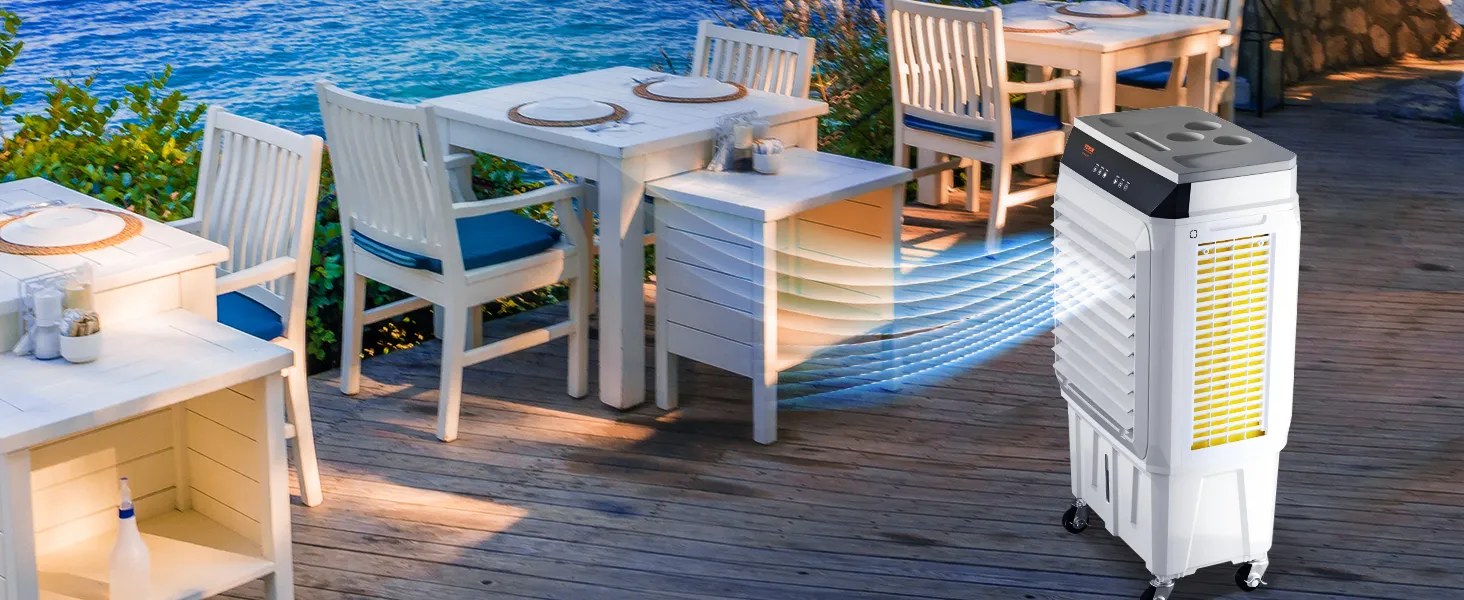 VEVOR evaporative air cooler blowing cool air at outdoor dining area with ocean view and white wooden furniture.