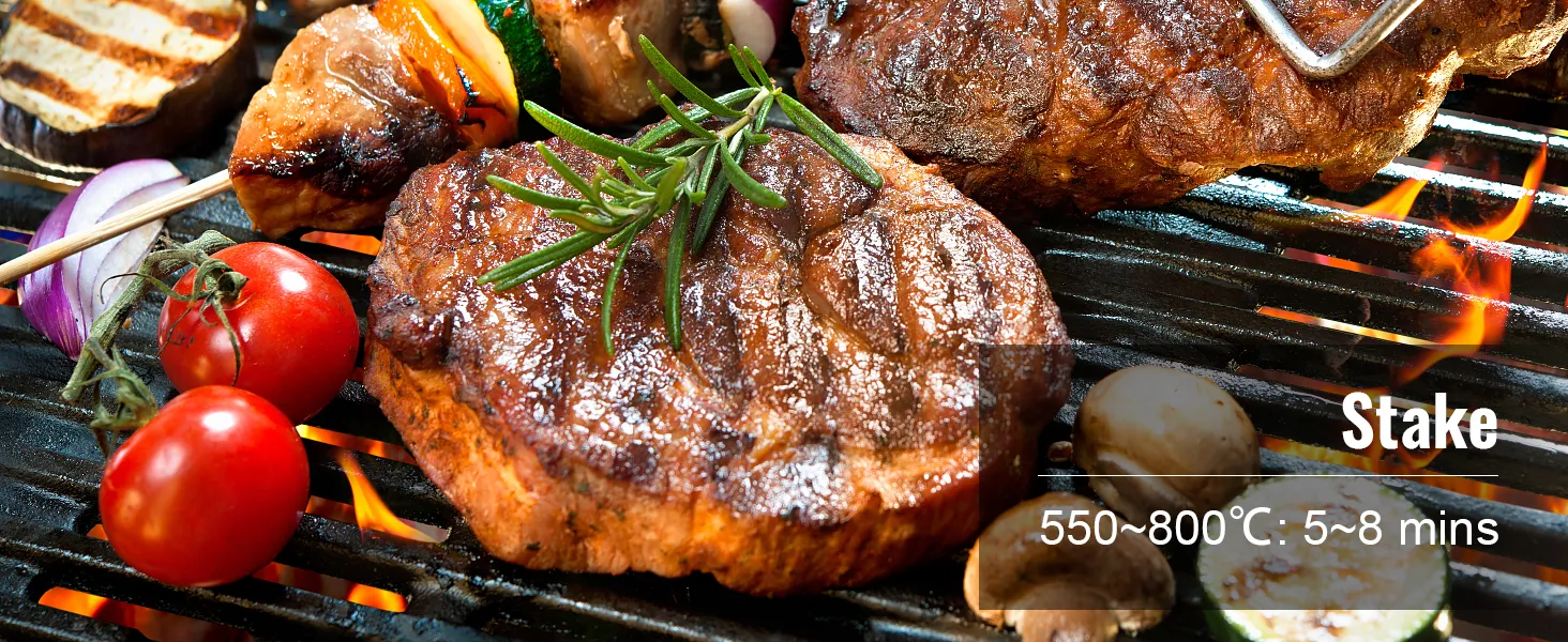 grilling seasoned steak, tomatoes, and vegetables over open flame on a VEVOR ceramic barbecue grill.