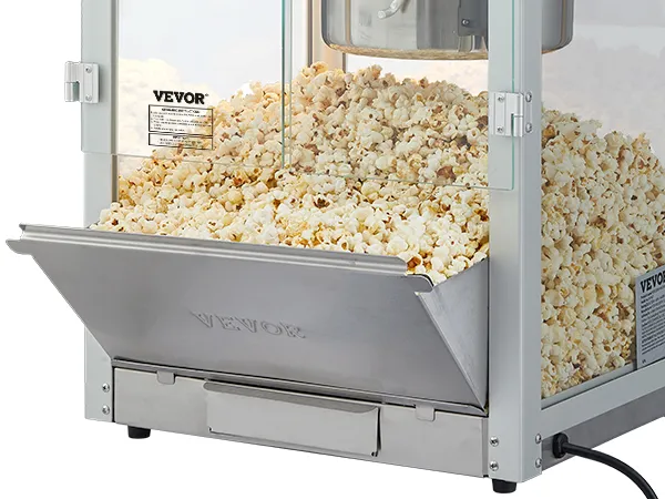 VEVOR popcorn popper machine filled with fresh popcorn in a stainless steel chute.