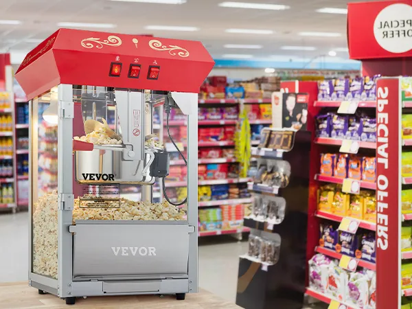 VEVOR popcorn popper machine displayed in a grocery store aisle filled with colorful products and special offers.