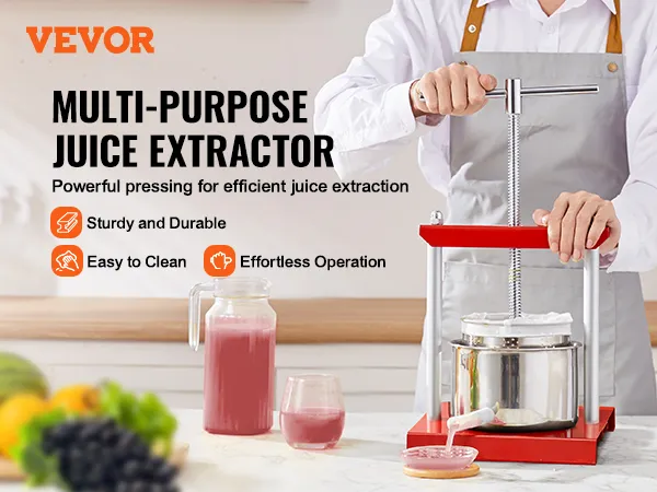 VEVOR fruit wine press being used to extract juice with fruits and juice pitcher on the countertop.