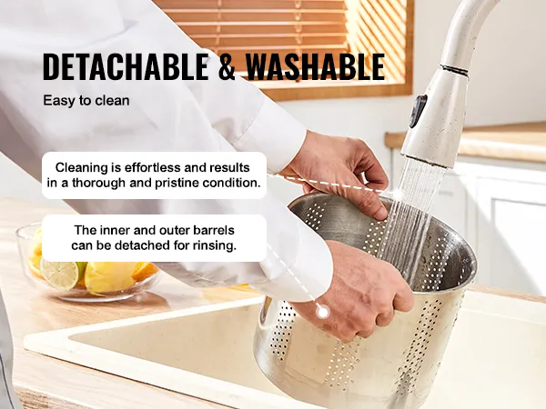 detachable and washable VEVOR fruit wine press barrel being rinsed under a kitchen faucet.