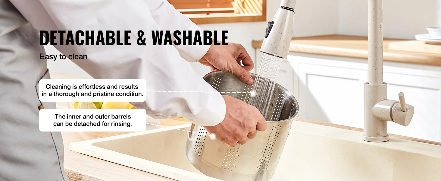 detachable and washable VEVOR fruit wine press barrel being rinsed under a kitchen faucet.