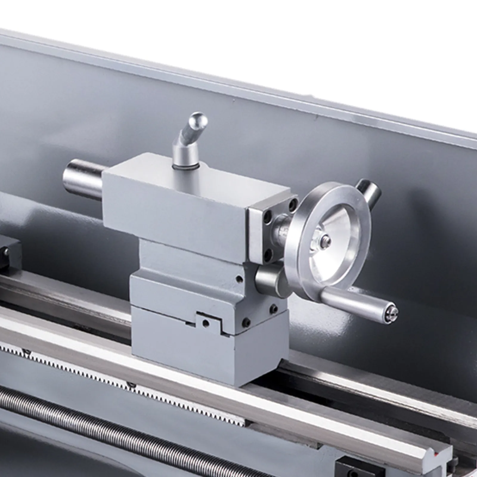 silver-toned VEVOR metal lathe close-up showcasing spindle and tool holder.