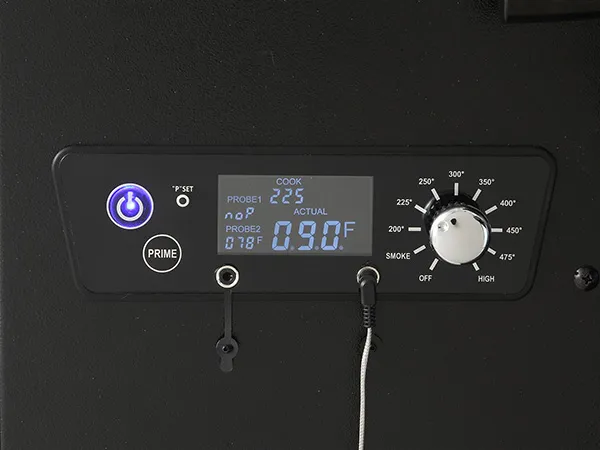 control panel of VEVOR charcoal grill showing temperature settings and knobs for smoke and heating.