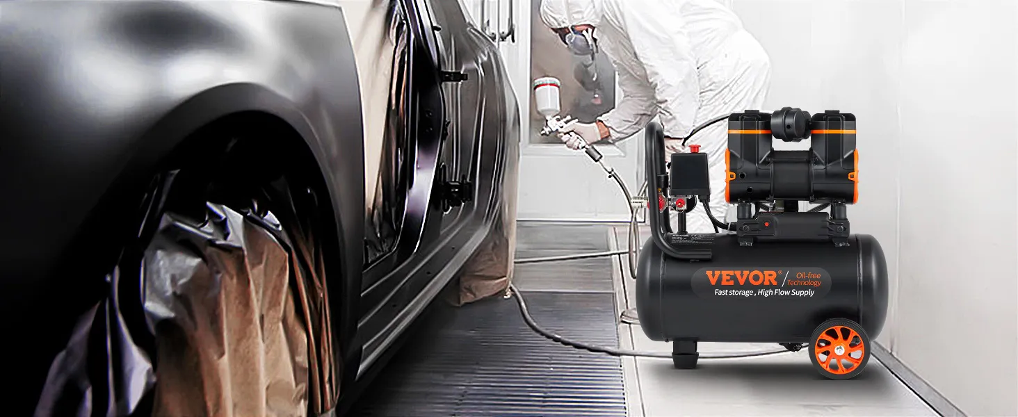 Compresor de aire ultra silencioso VEVOR en un taller de pintura de automóviles, con un técnico pintando con aerosol un vehículo.