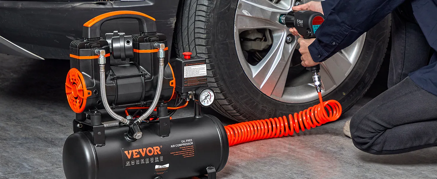 VEVOR ultra quiet air compressor in use, inflating a car tire with an orange hose.