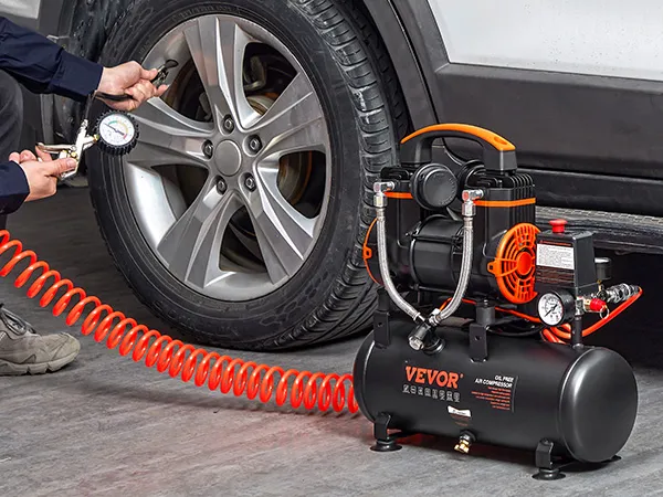 VEVOR ultra quiet air compressor inflating a car tire with an orange spiral hose.