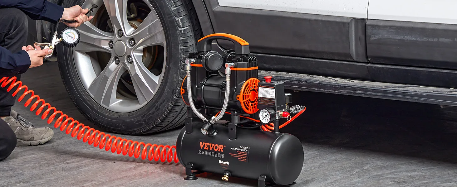 VEVOR ultra quiet air compressor inflating a car tire with an orange spiral hose.