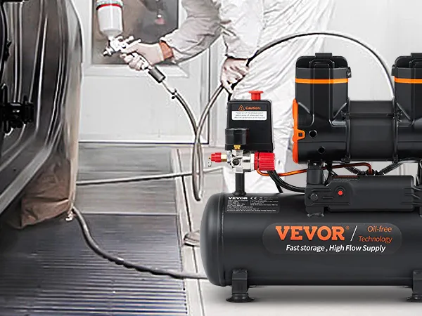 spray painter using VEVOR ultra quiet air compressor on black car in workshop.