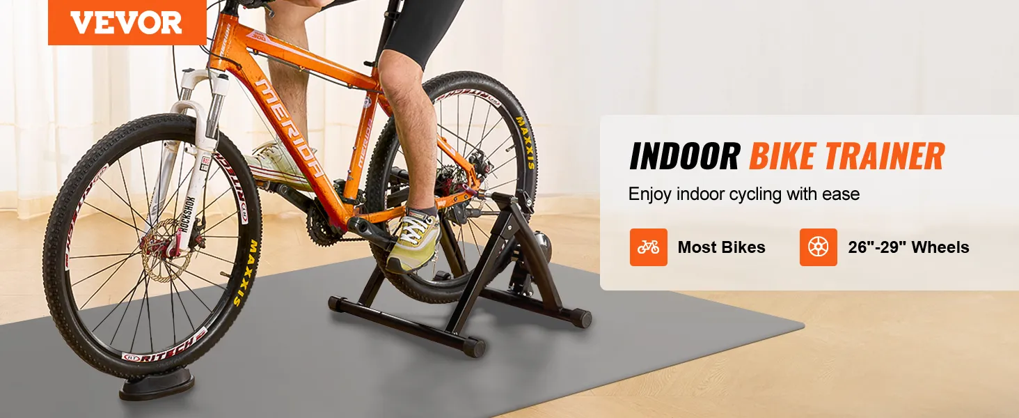 VEVOR bike trainer stand with orange bike, suitable for most bikes, 26"-29" wheels, for indoor cycling.