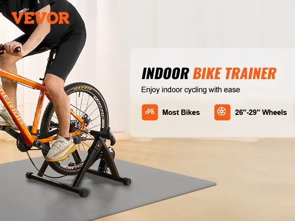cyclist on VEVOR bike trainer stand with orange bike, promoting indoor cycling for 26"-29" wheels.