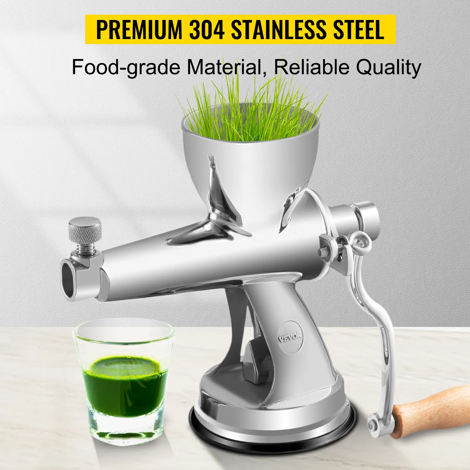 VEVOR wheatgrass juicer in stainless steel with a glass of fresh green juice.
