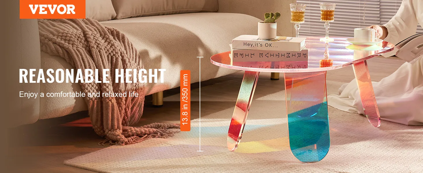Mesa de centro de acrílico VEVOR en sala de estar con libros, tazas y ambiente confortable.
