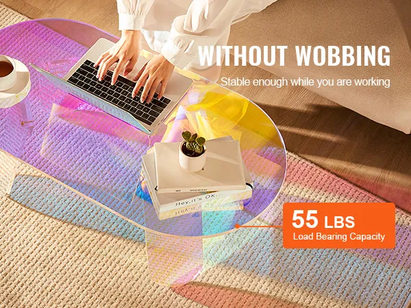 Mesa de centro de acrílico VEVOR con capacidad de carga de 55 libras, que presenta un diseño colorido en una acogedora sala de estar.