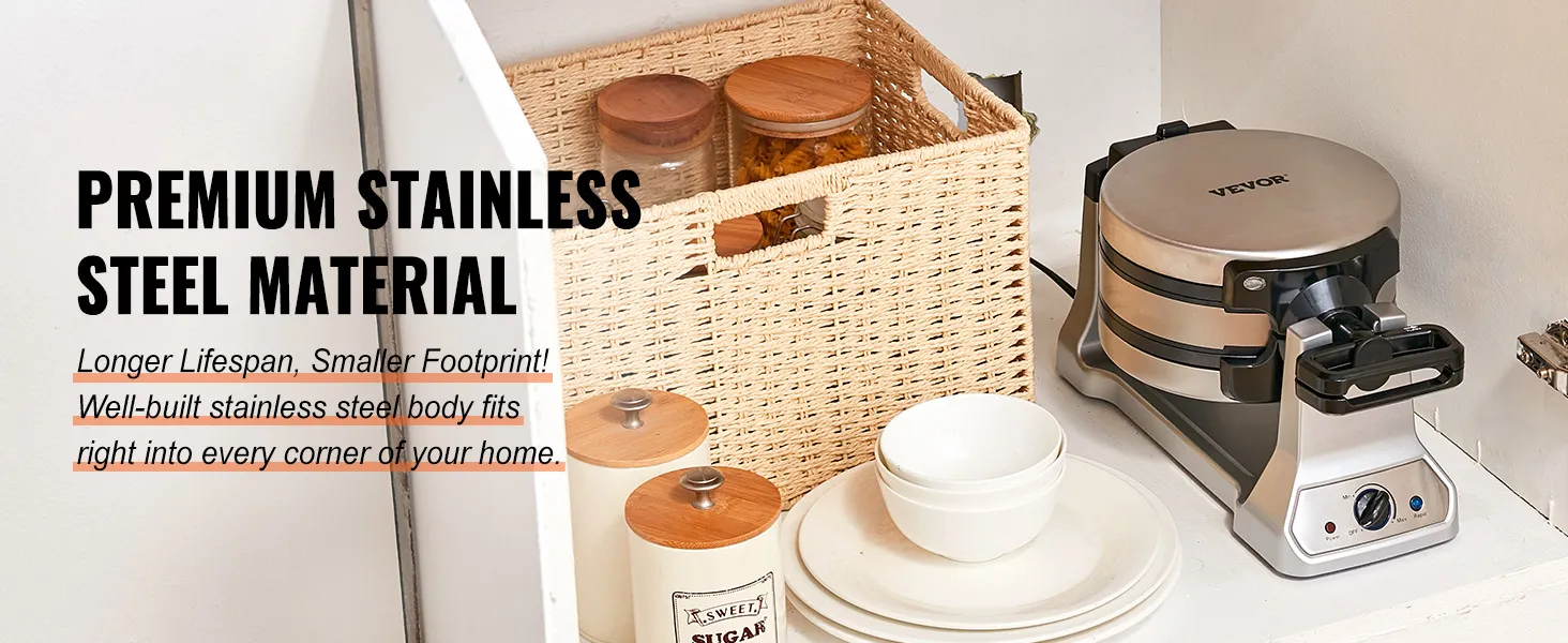 Máquina para hacer gofres VEVOR con cuerpo de acero inoxidable junto a una cesta tejida y utensilios de cocina de cerámica en un armario.