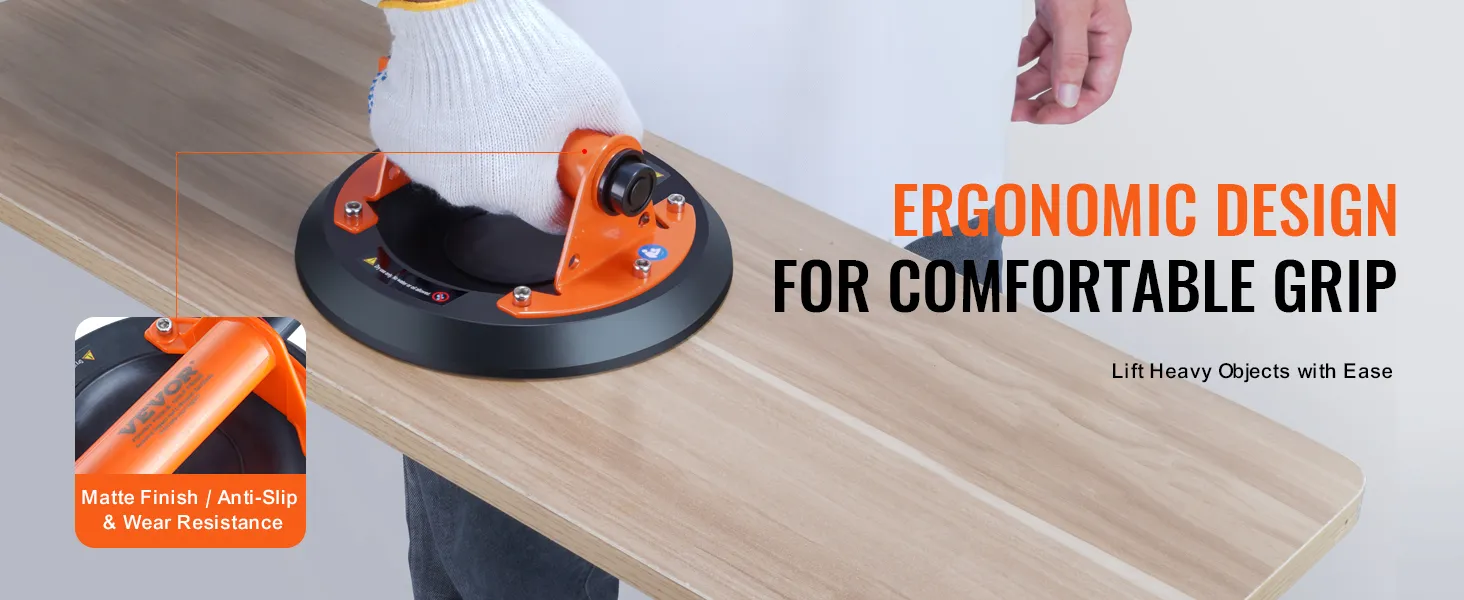 persona che utilizza una ventosa ergonomica in vetro VEVOR su una superficie di legno, dimostrando presa e durata.