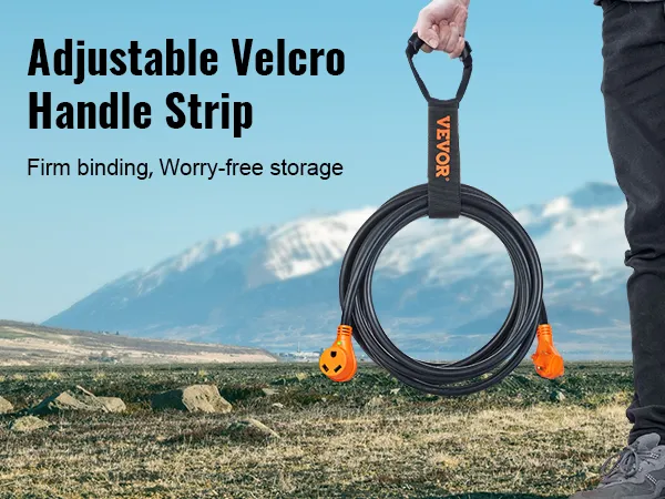 person holding VEVOR rv extension cord with adjustable velcro handle strip, mountains in the background.