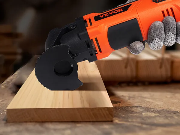 worker using VEVOR oscillating tool on a wooden plank in a workshop environment.
