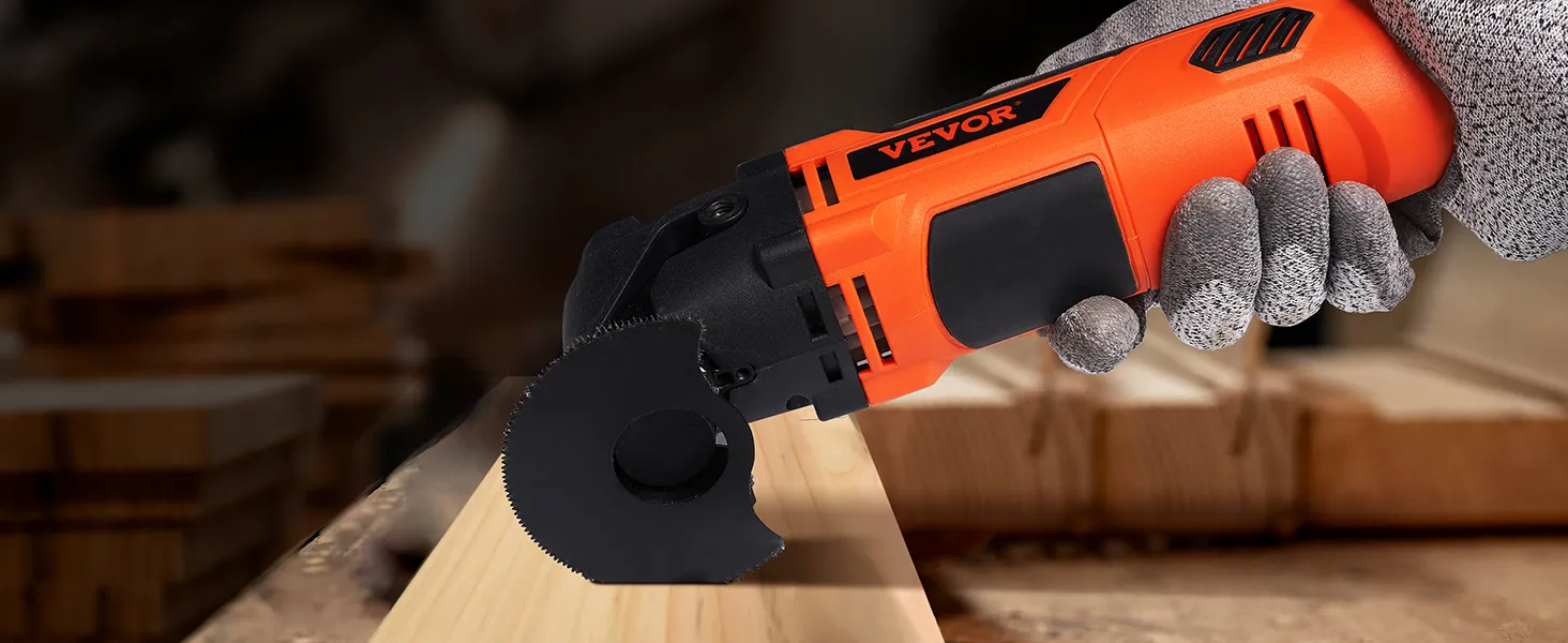 worker using VEVOR oscillating tool on a wooden plank in a workshop environment.