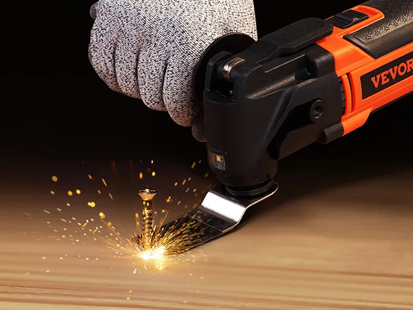 VEVOR oscillating tool cutting a metal bolt with sparks flying, held by a gloved hand.