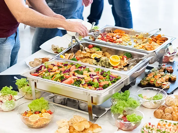 buffet setup with a VEVOR chafing dish set filled with colorful vegetables and appetizers.