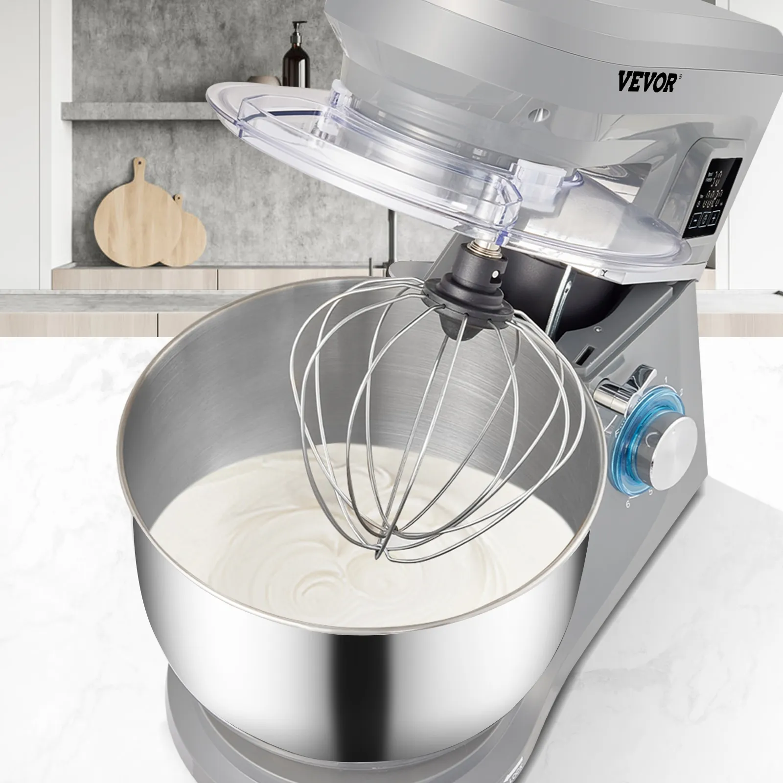 VEVOR stand mixer in a modern kitchen, mixing white batter with a stainless steel whisk attachment.