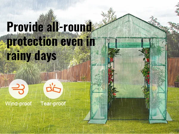 VEVOR walk-in greenhouse in a rainy backyard, promoting wind-proof and tear-proof features.