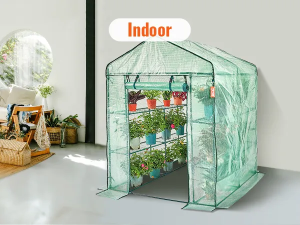 VEVOR walk-in greenhouse in a bright, spacious indoor room with plants and natural light.