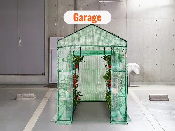 VEVOR walk-in greenhouse set up inside a concrete garage, showcasing potted plants on shelves.