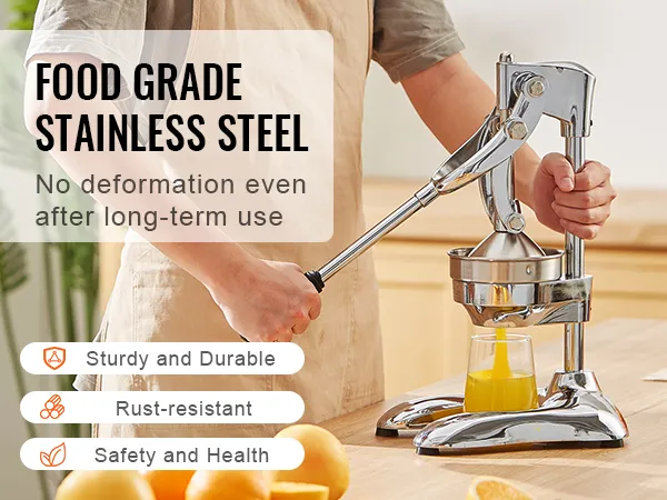 Persona que utiliza exprimidor de cítricos VEVOR en la cocina con naranjas, acero inoxidable de grado alimenticio, resistente al óxido.