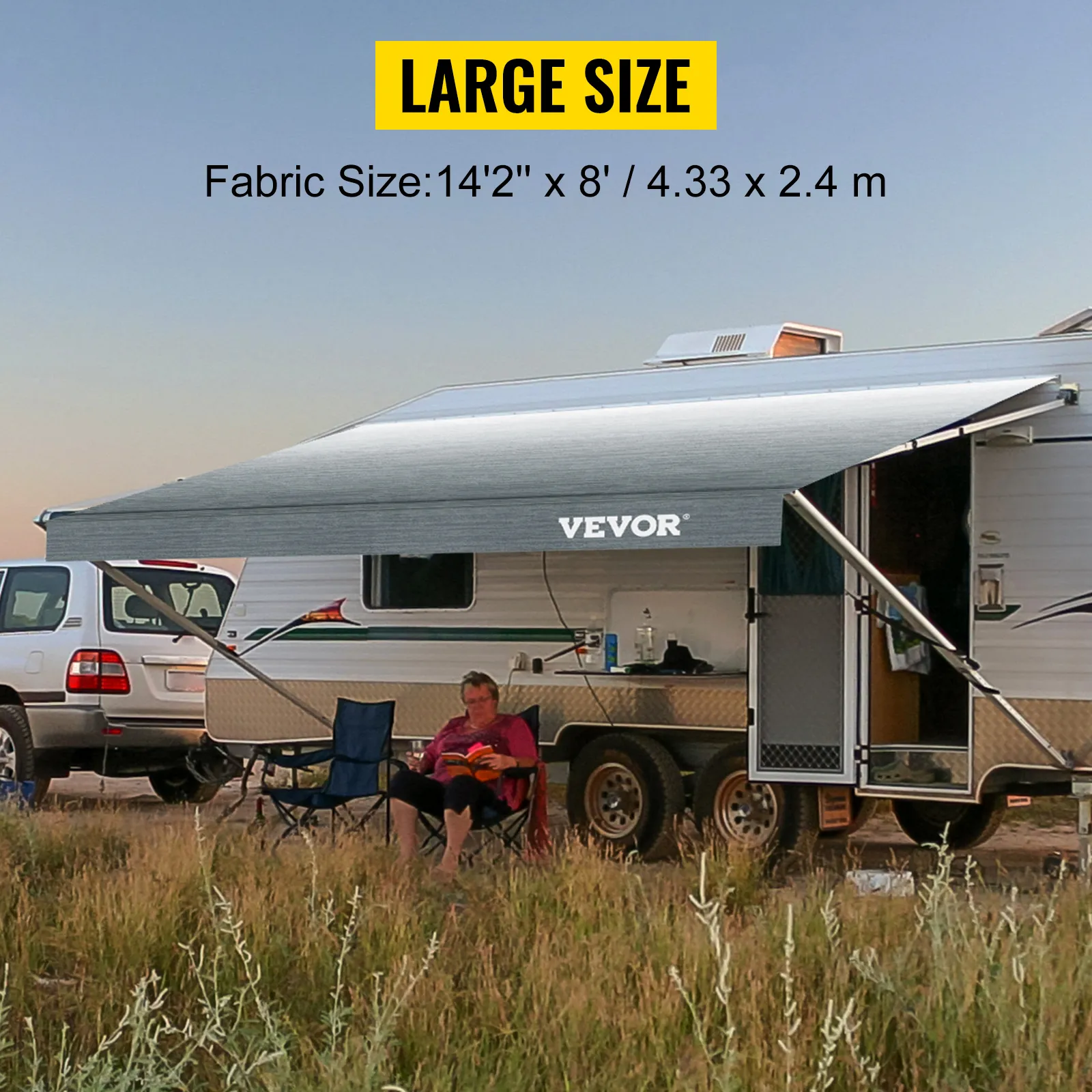 VEVOR rv awning in large size shading a camper with a chair and table setup.