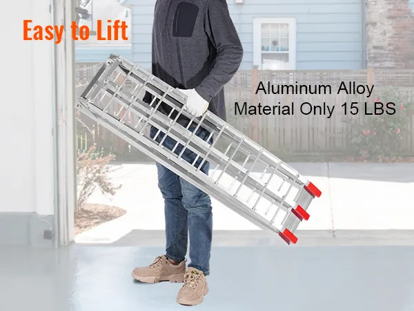 aluminum foldable VEVOR motorcycle ramps being carried, showcasing lightweight and easy lifting.