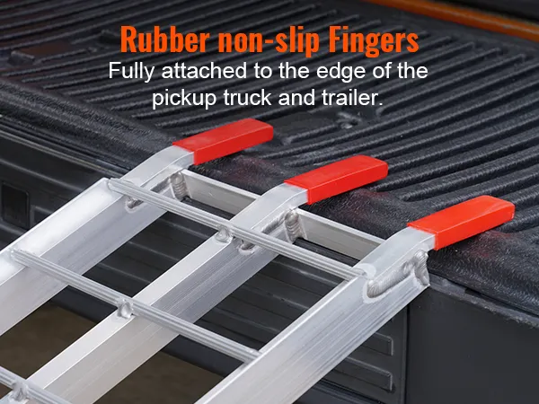 VEVOR motorcycle ramps with rubber non-slip fingers attached to a pickup truck edge.