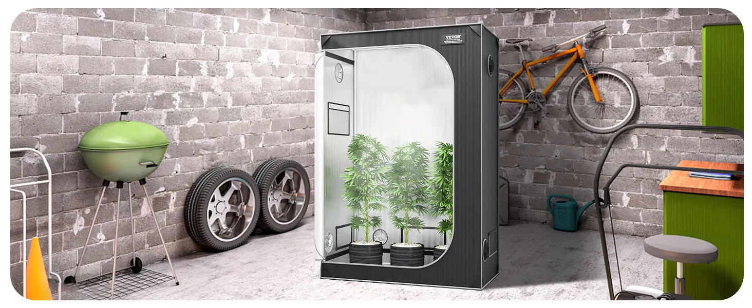 VEVOR grow tent in a garage with plants inside, next to a green grill, spare tires, and an orange bike.